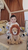 Baby playing with Louis Lion™ Smart Sensor